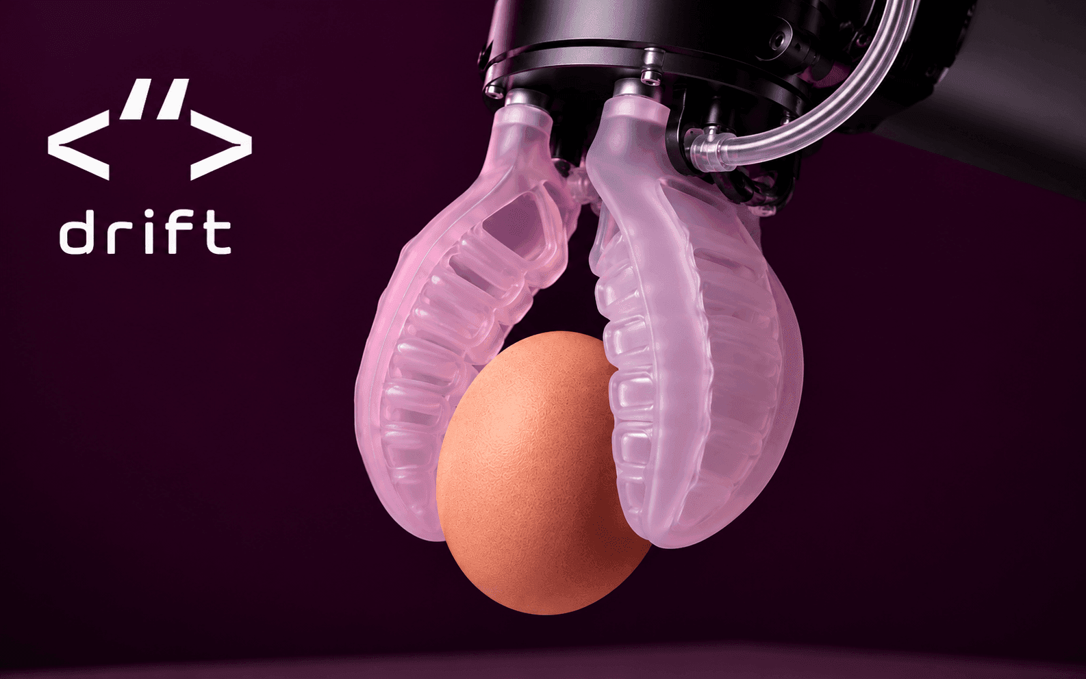A soft silicone robotic gripper gently picking up a raw egg